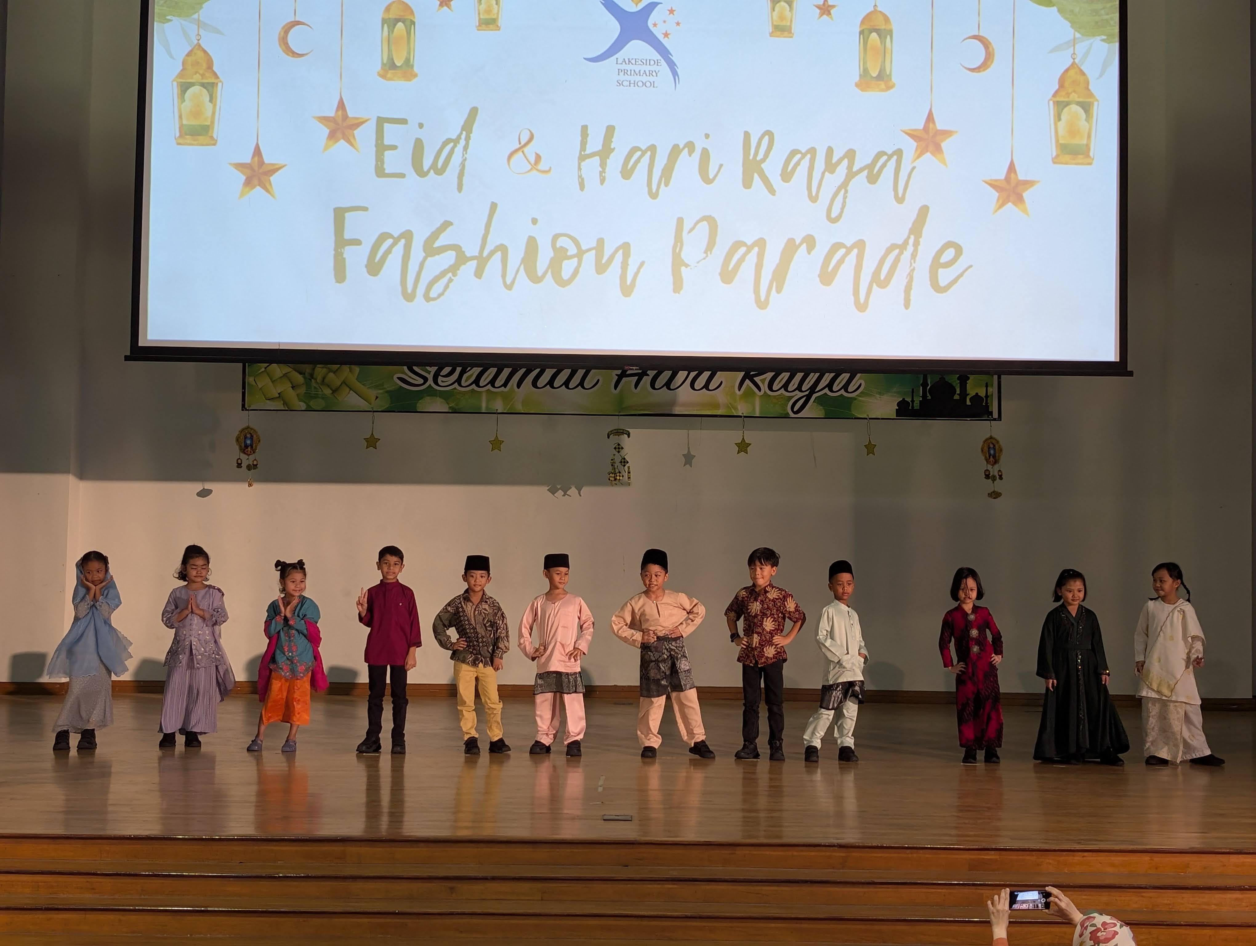 P1 and P2 students in a fashion parade, showcasing the various traditional Malay attires.